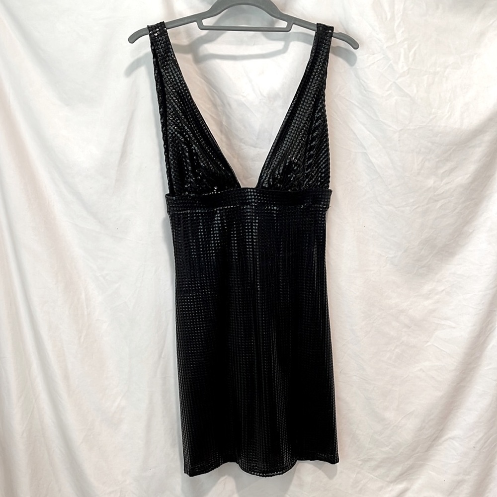 Black sequin dress. Runs small. Size large. More like a  medium but stretchy.